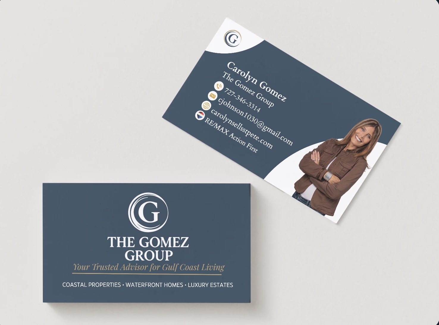 Two-sided business card: front is the full lockup, tagline, and category line on Storm Navy; back carries Carolyn's name, contact details, and headshot